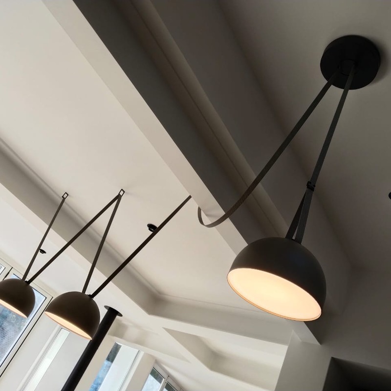 Electrician conducting an energy efficiency assessment in a residential home to recommend tailored upgrades.